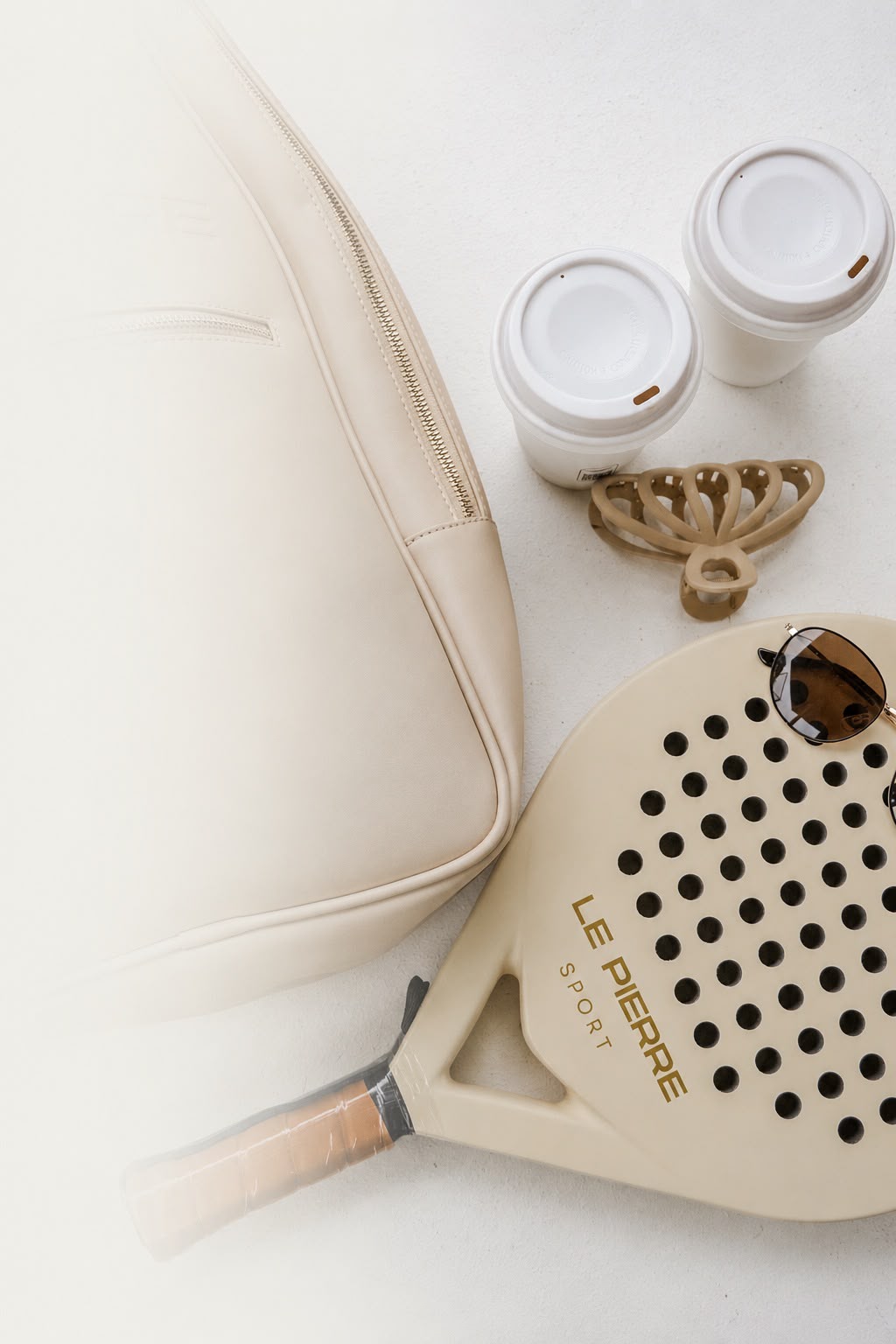 Le Pierre Sport flatlay with racket and bag