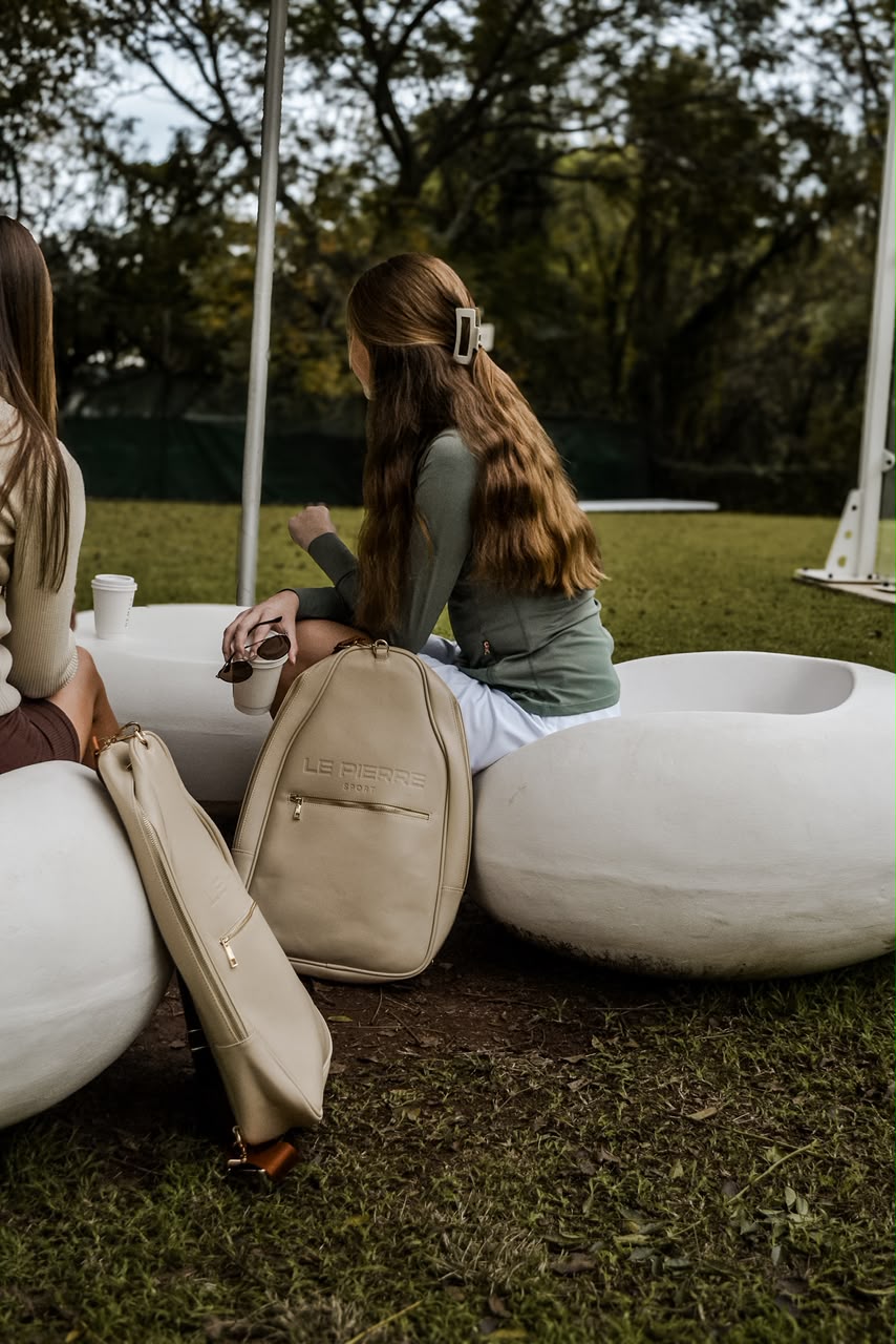 Le Pierre Sport Padel Bag beside seating